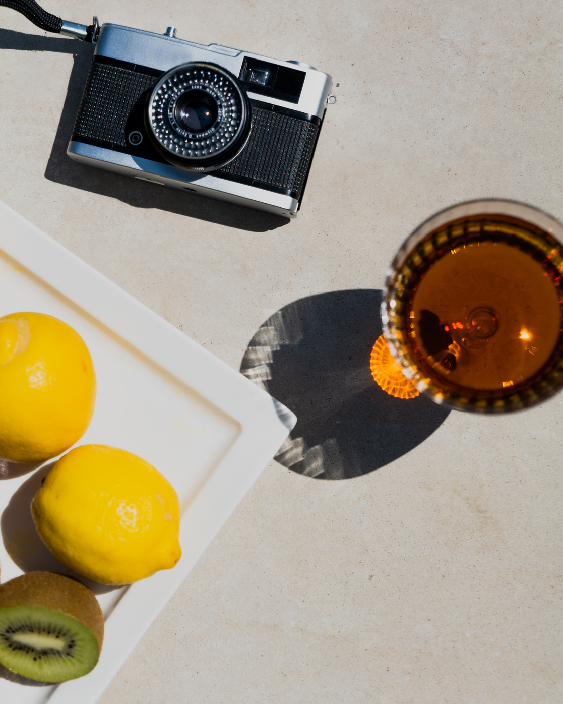 Alcohol and Camera on Poolside